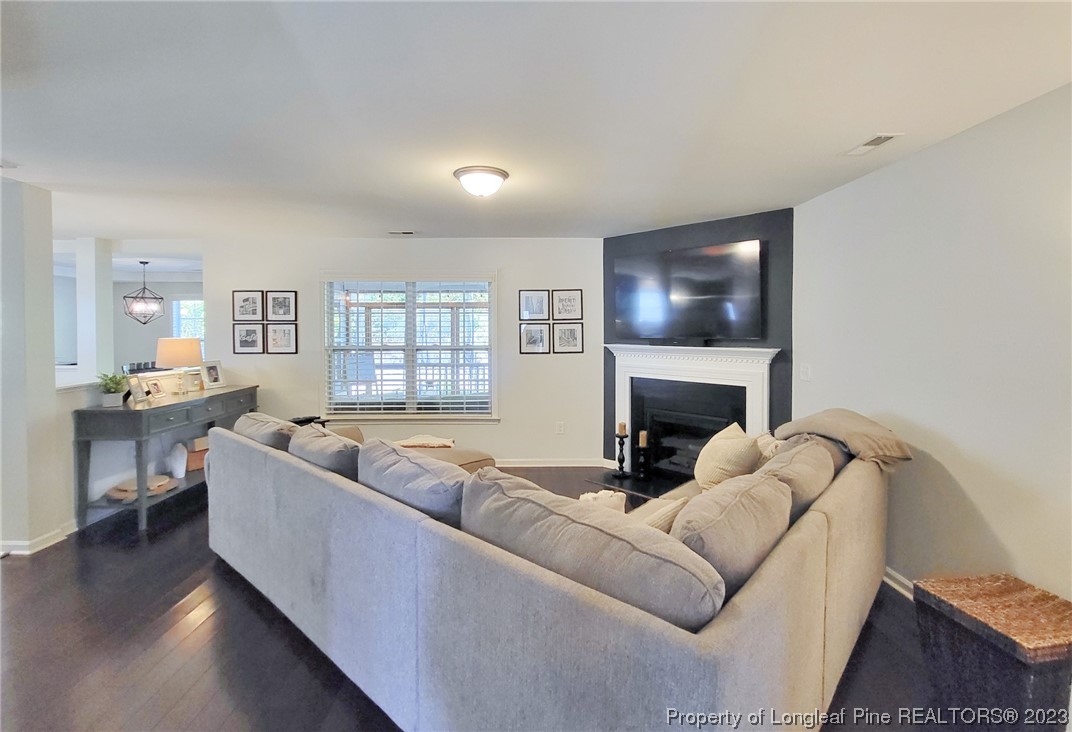 30 Bicentennial Way Cameron, NC 28326 - Photo 8 of 42 a living room with furniture and a fireplace