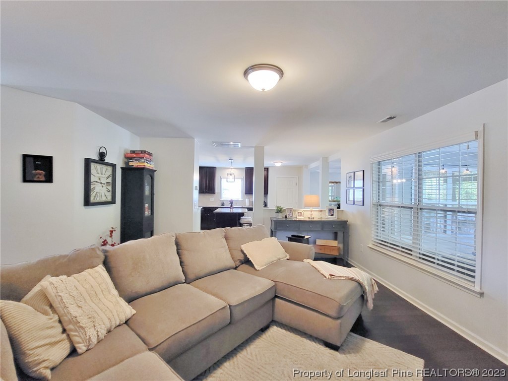 30 Bicentennial Way Cameron, NC 28326 - Photo 10 of 42 a living room with furniture white walls and white walls