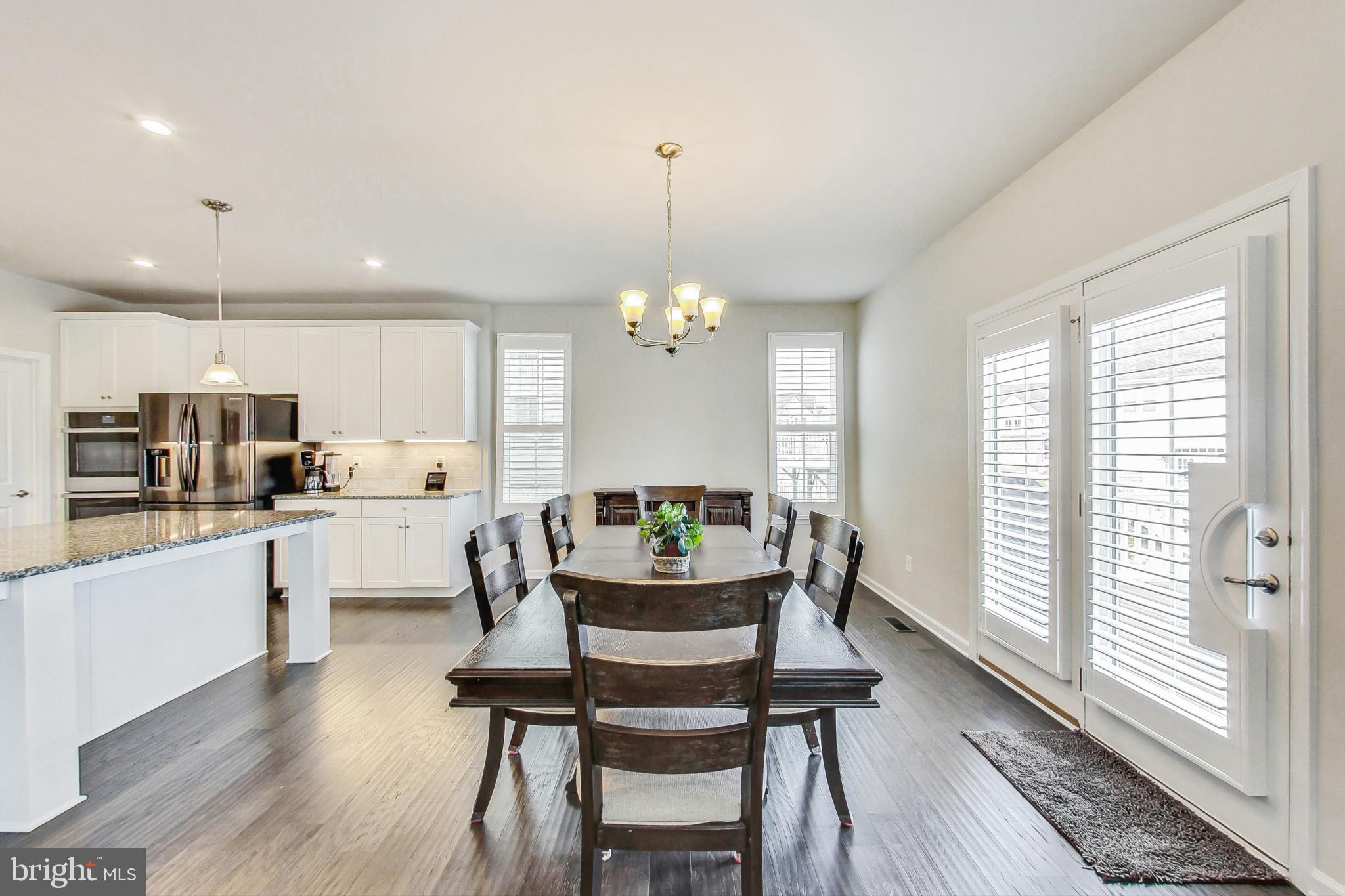 4513 Cotswold Manor Loop Woodbridge, VA 22192 - Photo 12 of 73 Spacious DR off kitchen w/ extra seating at island