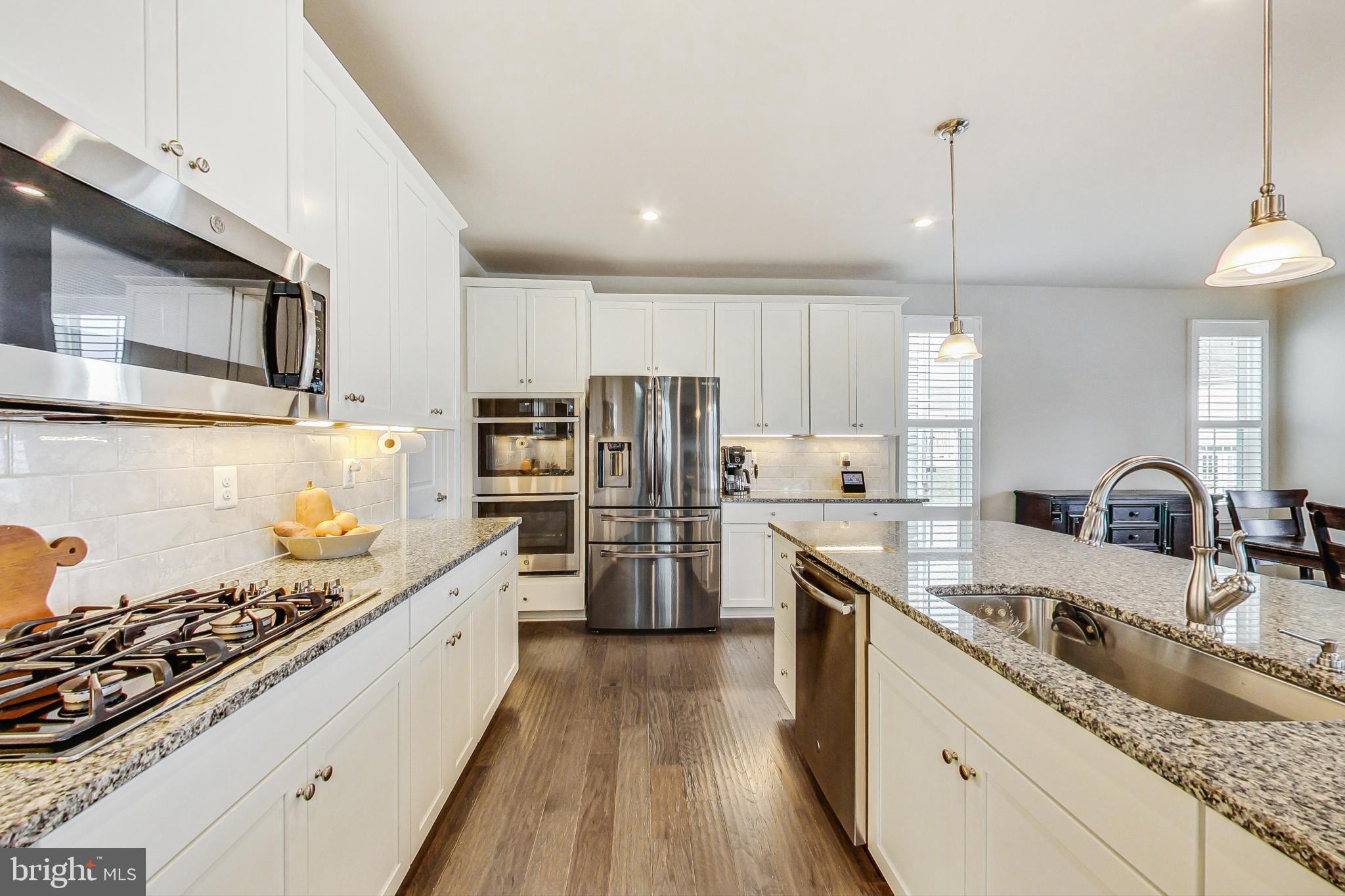 4513 Cotswold Manor Loop Woodbridge, VA 22192 - Photo 16 of 73 Big, open kitchen w/ 42" cabs, SS appls & granite
