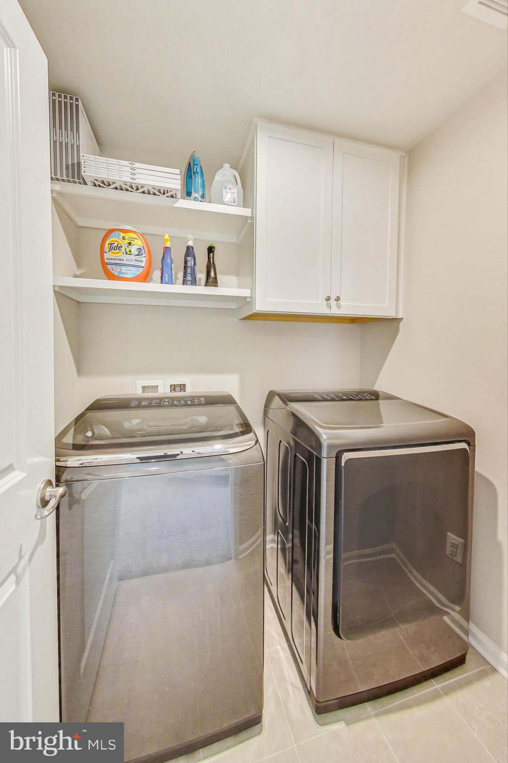 4513 Cotswold Manor Loop Woodbridge, VA 22192 - Photo 52 of 73 BR-level laundry w/ shelves/cabinets/ceramic tile