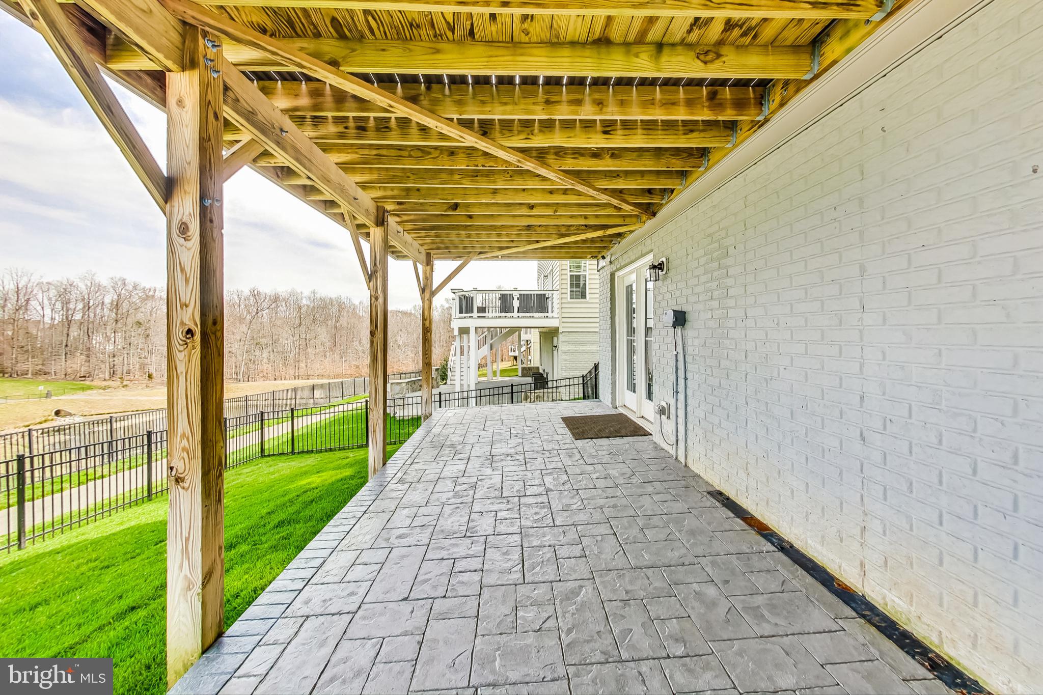 4513 Cotswold Manor Loop Woodbridge, VA 22192 - Photo 68 of 73 House-width stamped-concrete patio