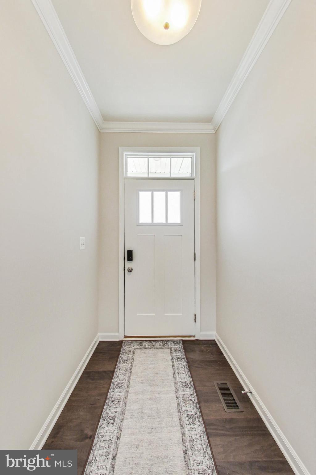 4513 Cotswold Manor Loop Woodbridge, VA 22192 - Photo 7 of 73 Foyer w/ crown molding & hardwood floors