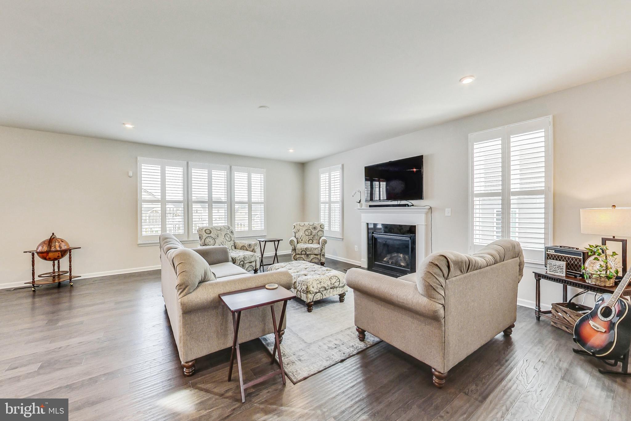 4513 Cotswold Manor Loop Woodbridge, VA 22192 - Photo 9 of 73 Great room with gas FP, HWs & loads of windows