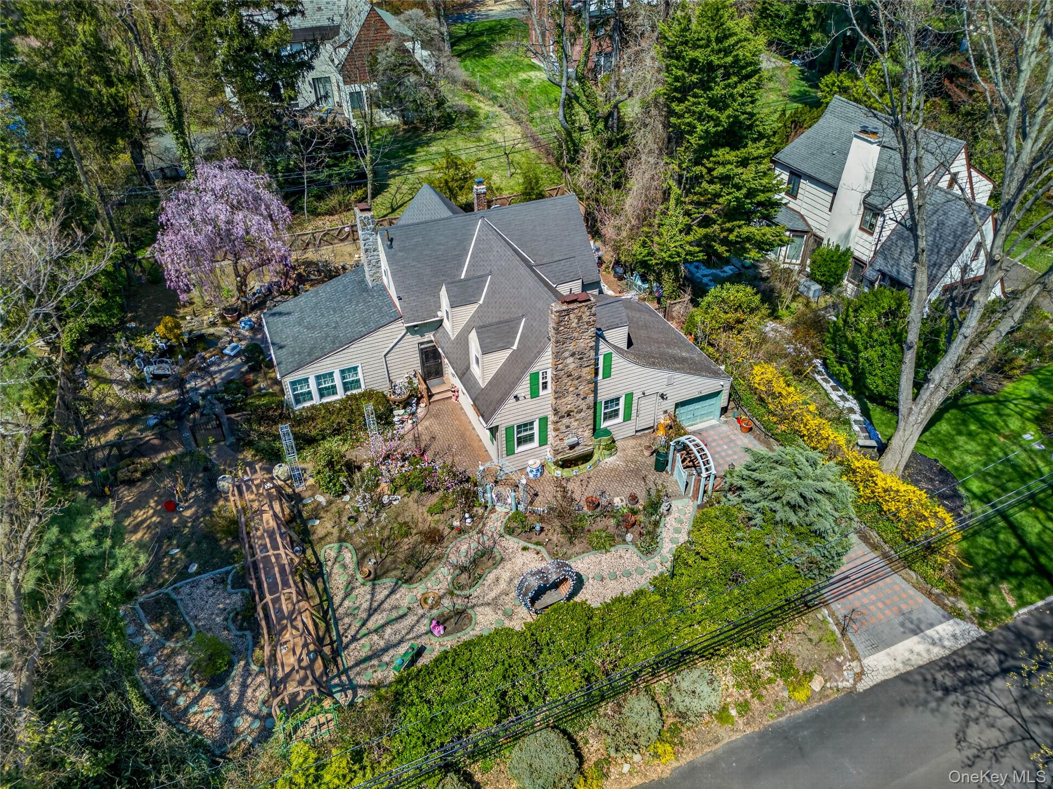 an aerial view of a house with a garden
