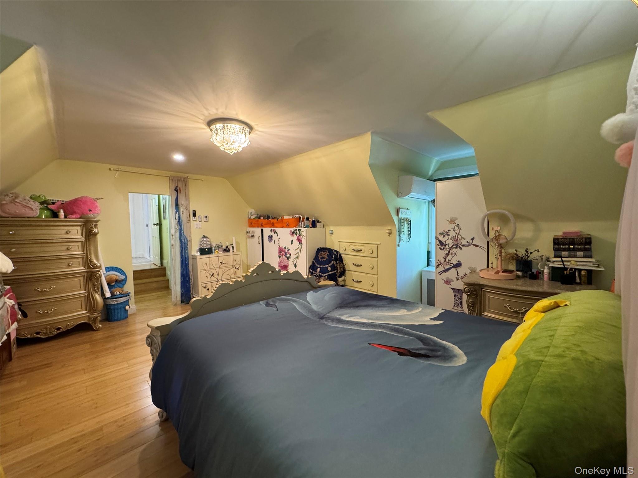 16 Ascot Ridge Great Neck, NY 11021 - Photo 17 of 23 Bedroom featuring vaulted ceiling and light wood-style flooring