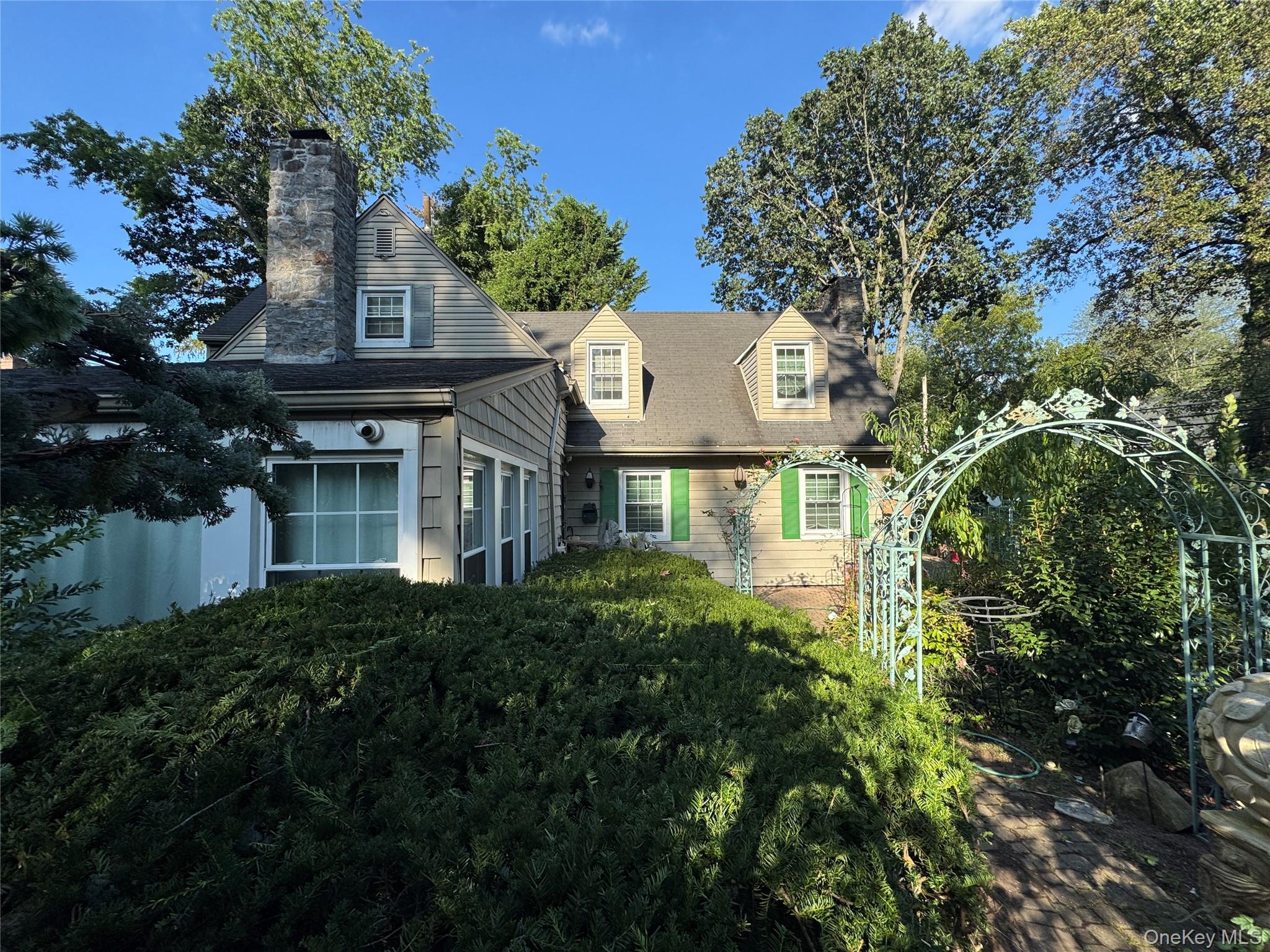 16 Ascot Ridge Great Neck, NY 11021 - Photo 2 of 23 Cape cod home featuring a chimney