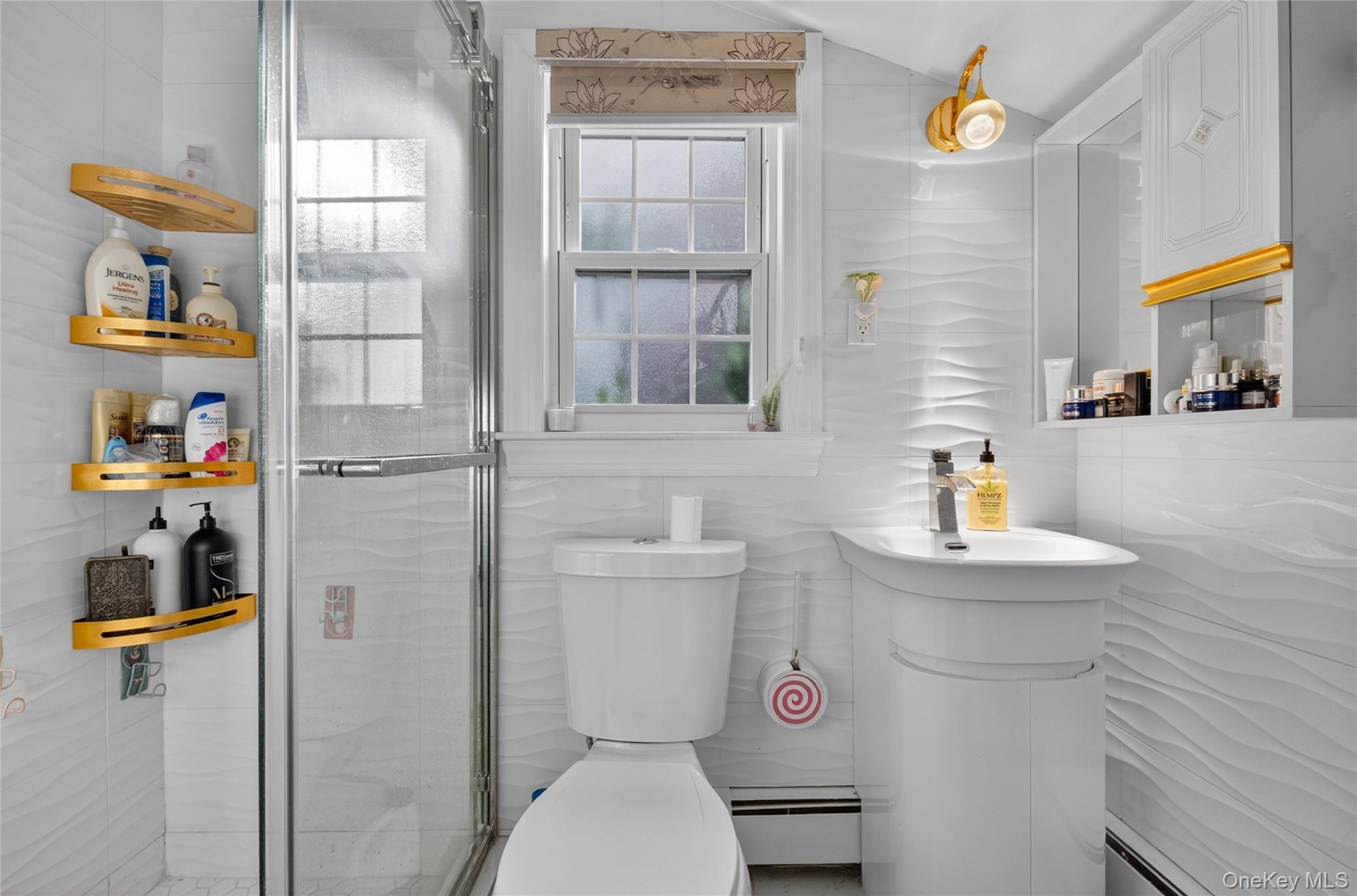 16 Ascot Ridge Great Neck, NY 11021 - Photo 21 of 33 a bathroom with a sink a toilet and a shower