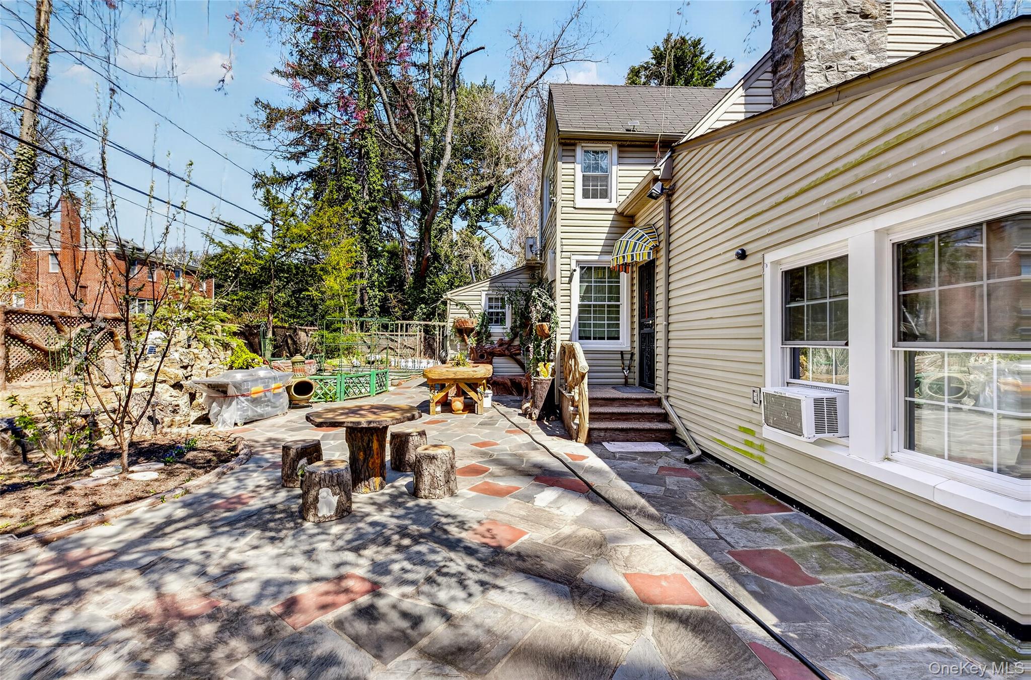 16 Ascot Ridge Great Neck, NY 11021 - Photo 26 of 33 a view of a patio with table and chairs and potted plants