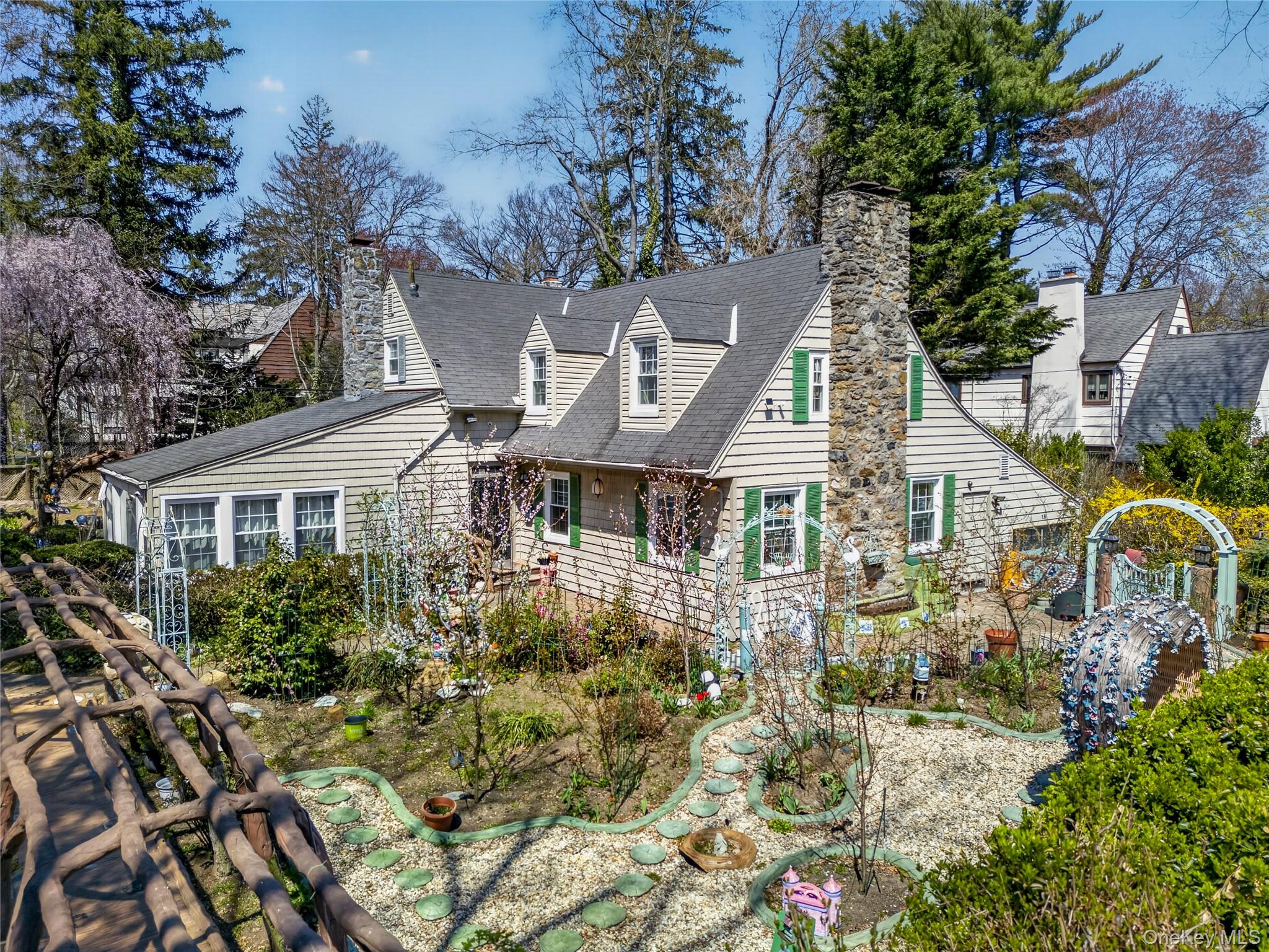 16 Ascot Ridge Great Neck, NY 11021 - Photo 3 of 33 a aerial view of a house with a yard and plants