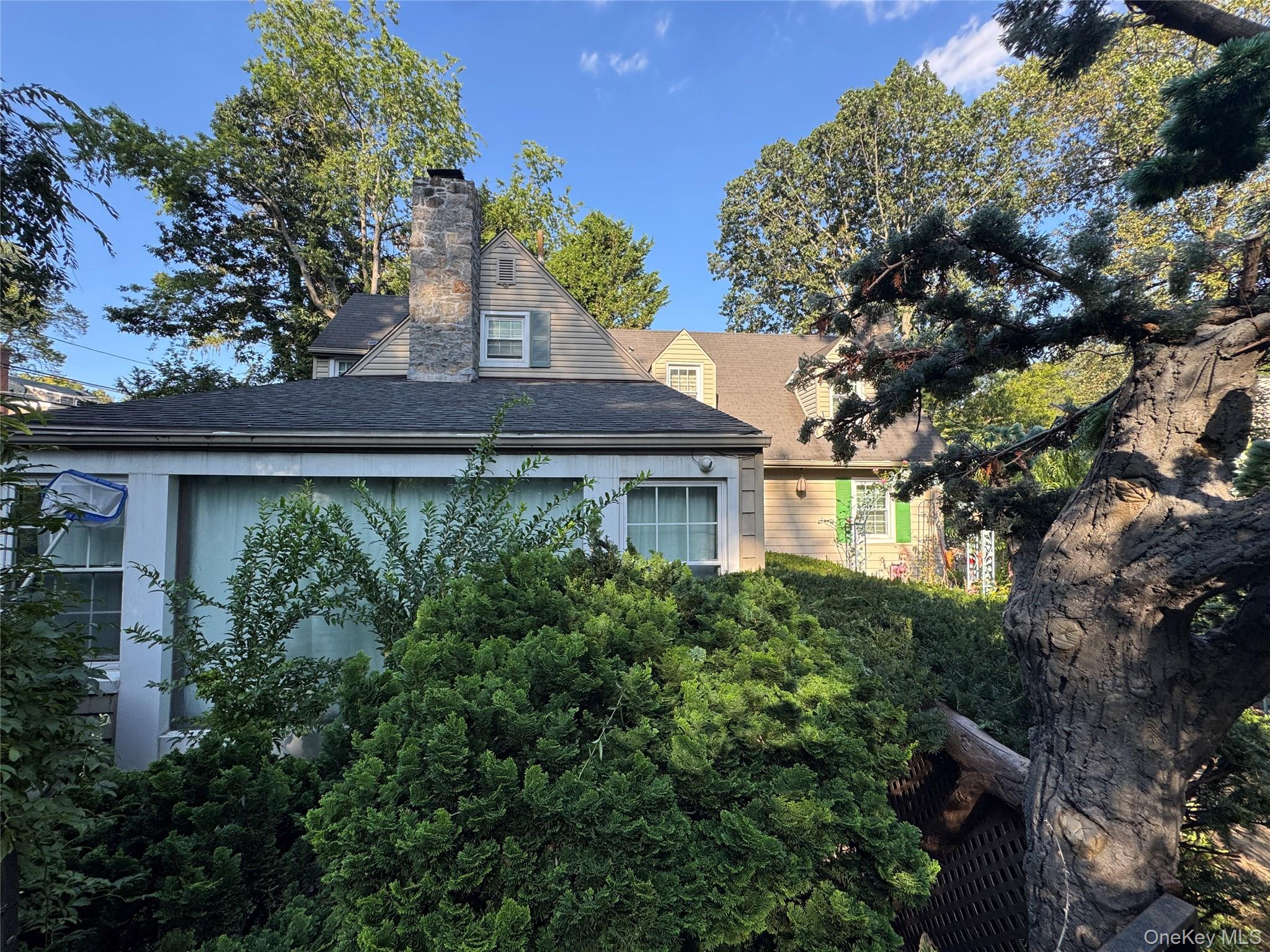 16 Ascot Ridge Great Neck, NY 11021 - Photo 3 of 23 View of property exterior with a chimney