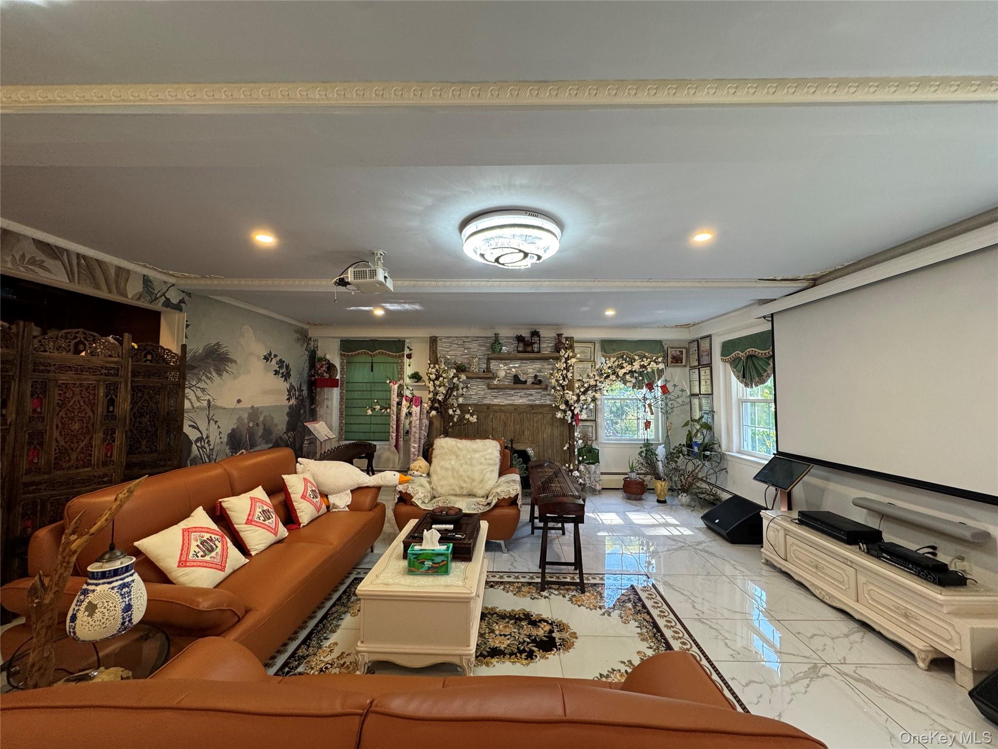 16 Ascot Ridge Great Neck, NY 11021 - Photo 7 of 23 Living area with marble tiled flooring and ornamental molding
