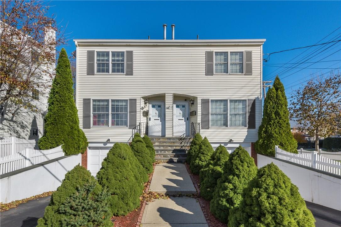 65-67 Palisade Road Rye, NY 10580 - Photo 1 of 1 a view of a house with brick walls and flower plants