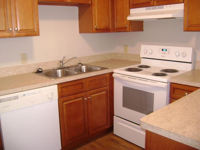 a utility room with sink dryer and washer