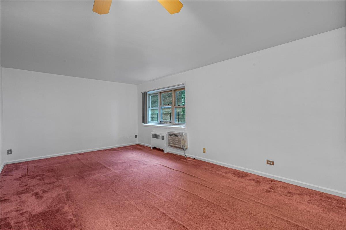 144-55 Melbourne Avenue, Unit 2F Queens, NY 11367 - Photo 11 of 21 an empty room with windows