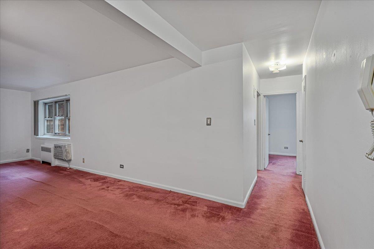 144-55 Melbourne Avenue, Unit 2F Queens, NY 11367 - Photo 4 of 21 wooden floor in an empty room