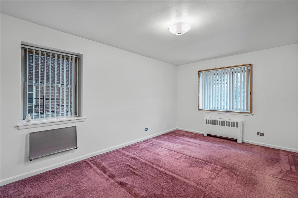 144-55 Melbourne Avenue, Unit 2F Queens, NY 11367 - Photo 5 of 21 an empty room with windows