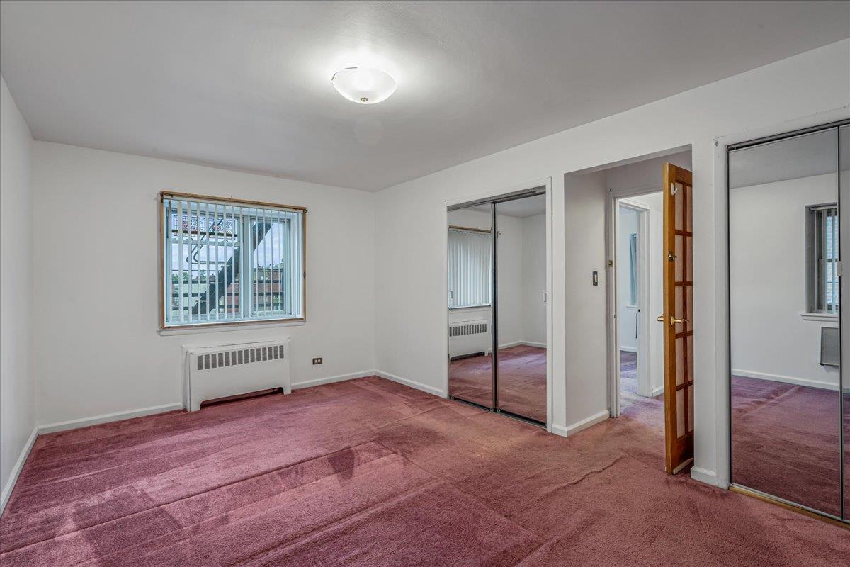 144-55 Melbourne Avenue, Unit 2F Queens, NY 11367 - Photo 6 of 21 a view of empty room with window and ceiling fan