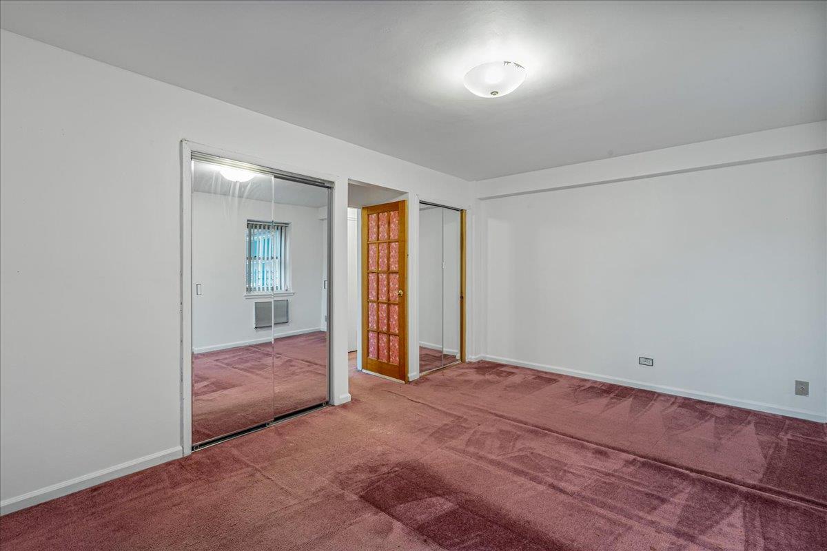 144-55 Melbourne Avenue, Unit 2F Queens, NY 11367 - Photo 7 of 21 an empty room with windows and closet