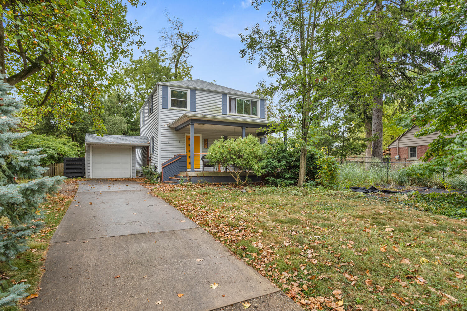front view of a house with a yard
