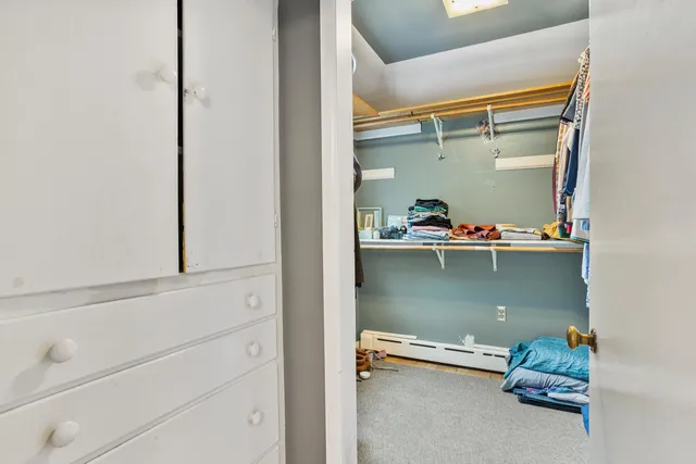 a room with a bed and a window