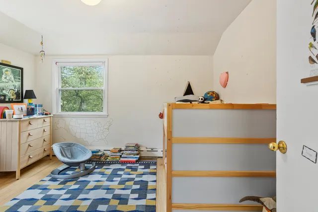 a room with toys and a baby crib