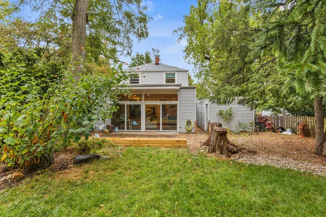 a view of backyard with large trees