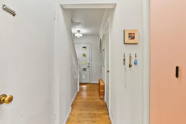 a view of a bathroom from a hallway