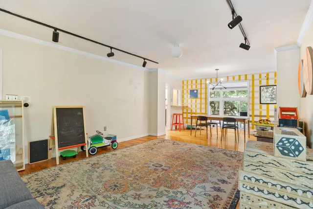 a bedroom with furniture and large window