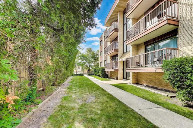 a view of a building with a yard