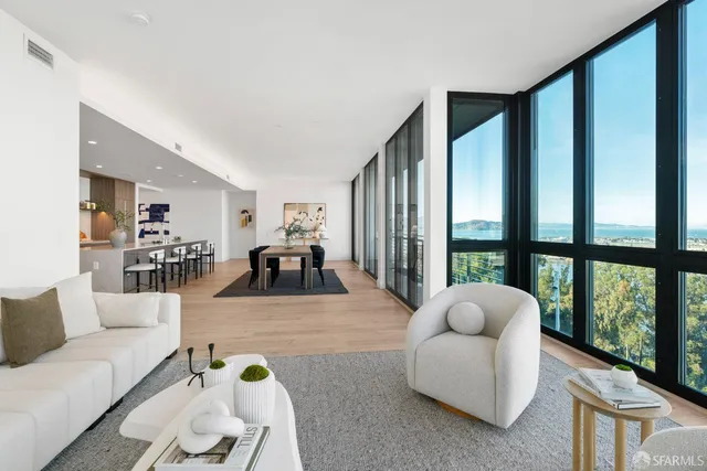 a kitchen with kitchen island a dining table and chairs
