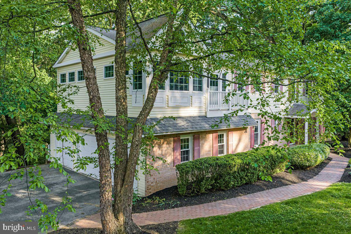 686 Limehouse Road Wayne, PA 19087 - Photo 46 of 51 a front view of a house with a garden
