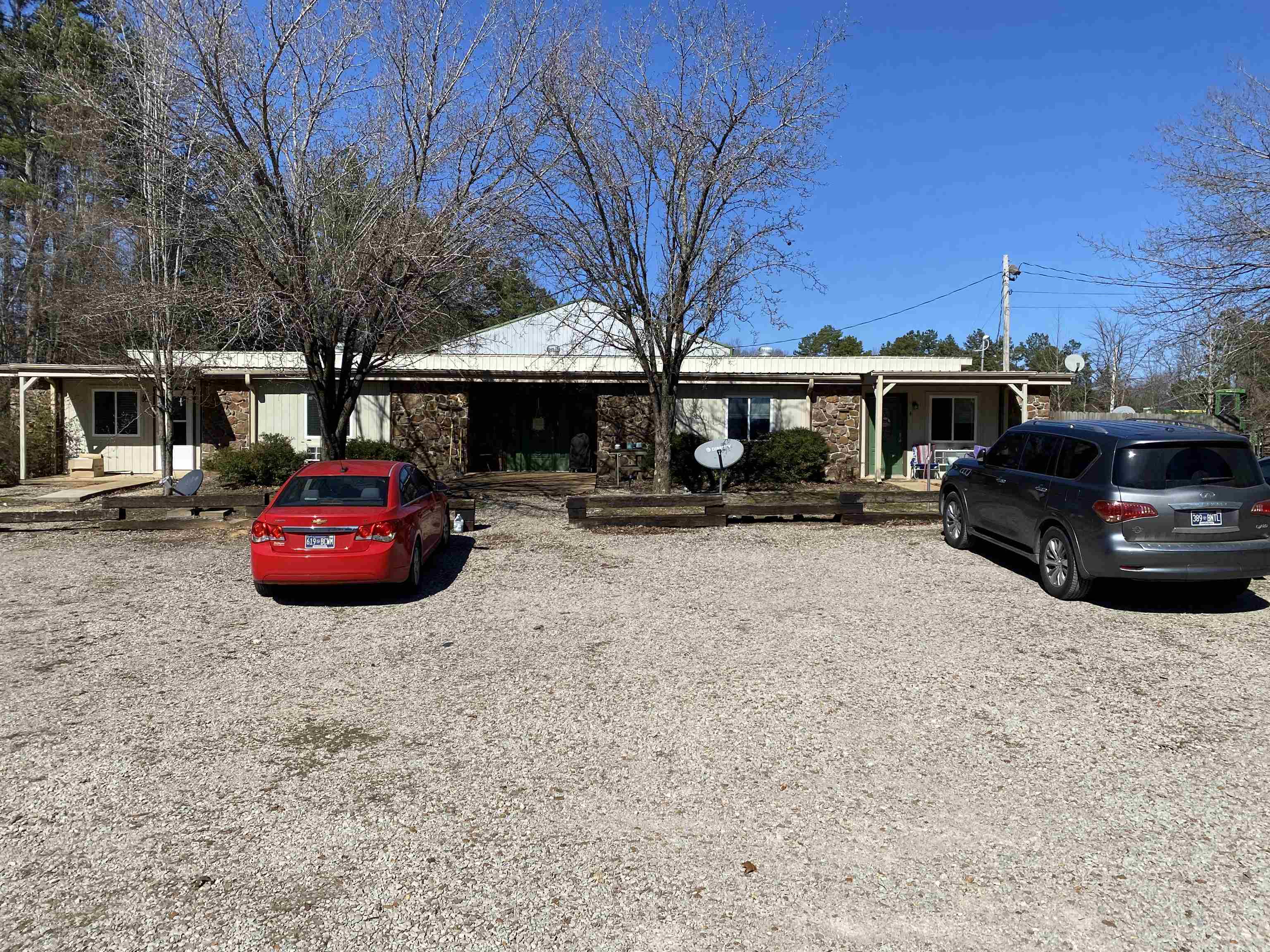 295 Highway 18 Loop Toone, TN 38381 - Photo 1 of 3 a car parked in front of a building