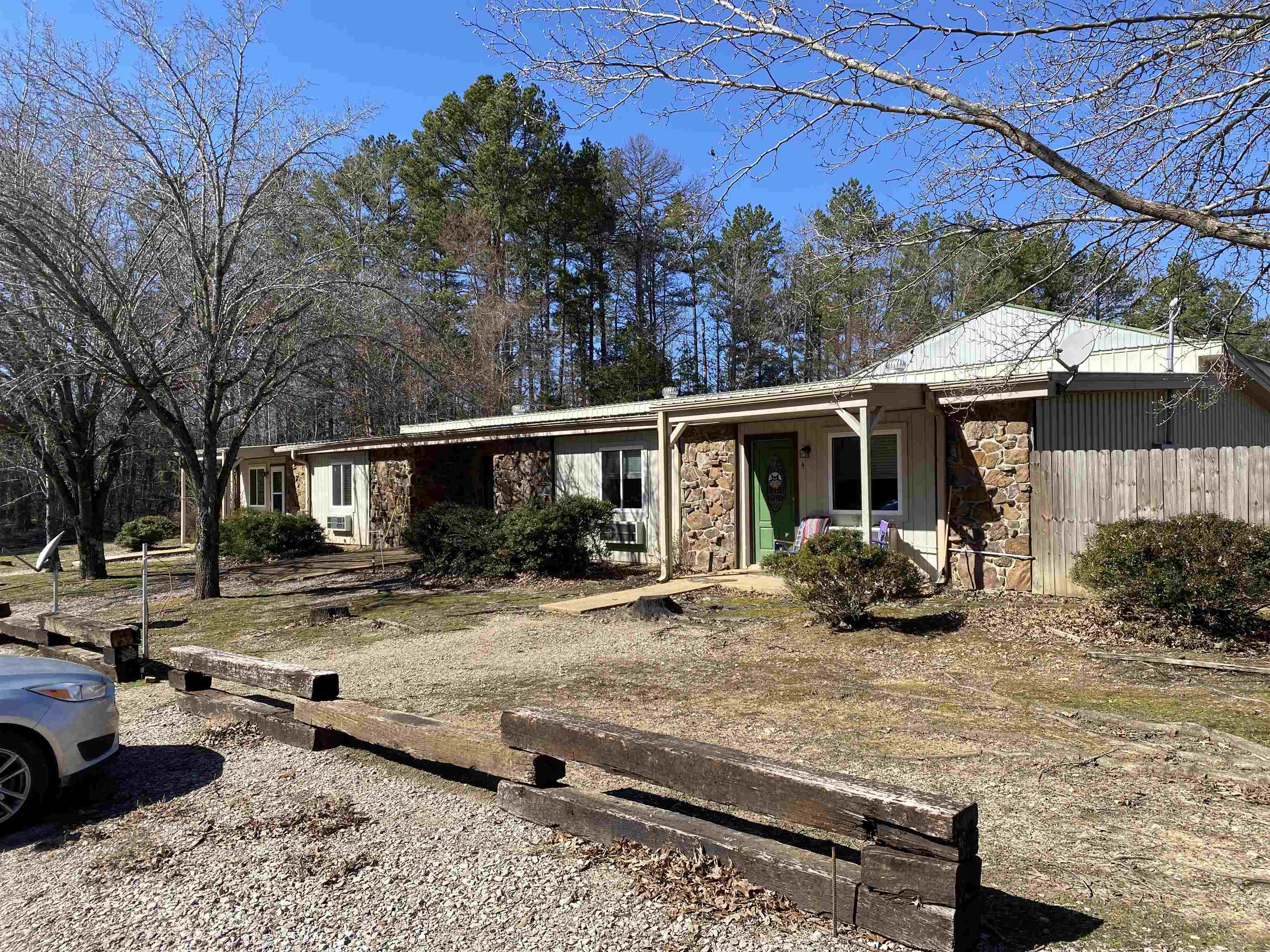 295 Highway 18 Loop Toone, TN 38381 - Photo 2 of 3 a view of a yard that has a car parked in it