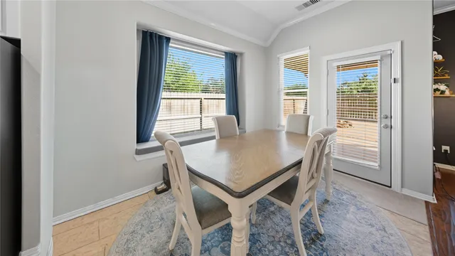 a view of a dining room with furniture