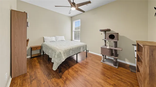 a bedroom with a bed and a table in it