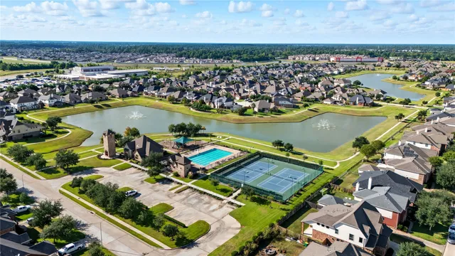 an aerial view of a house with a lake view