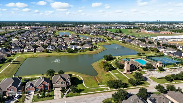 an aerial view of a house with a ocean view