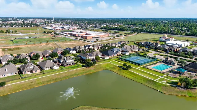 an aerial view of a city with lawn chairs
