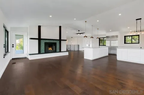 a view of a kitchen with furniture and a fireplace