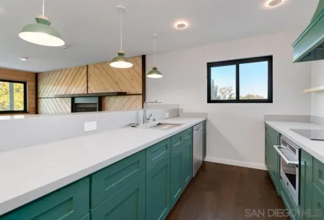 a bathroom with a sink toilet and mirror