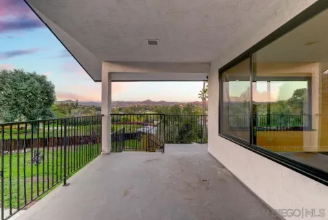 a view of a lake with a garden and trees