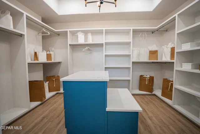 a room with cabinets and wooden floor