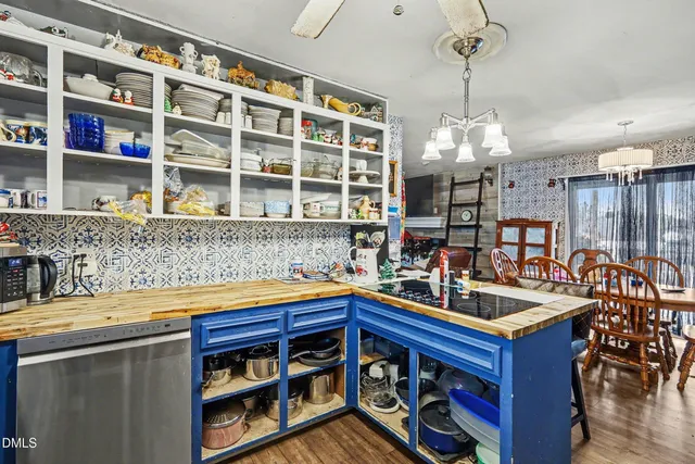 a kitchen with stainless steel appliances granite countertop a sink and a wooden cabinets