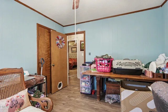a living room with furniture and a bed