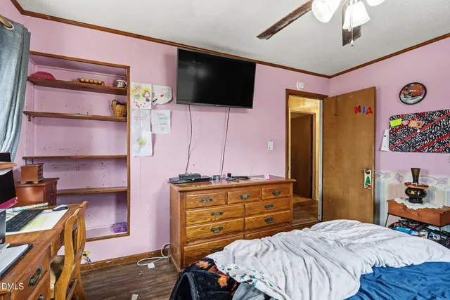 a bathroom with a sink mirror and a toilet