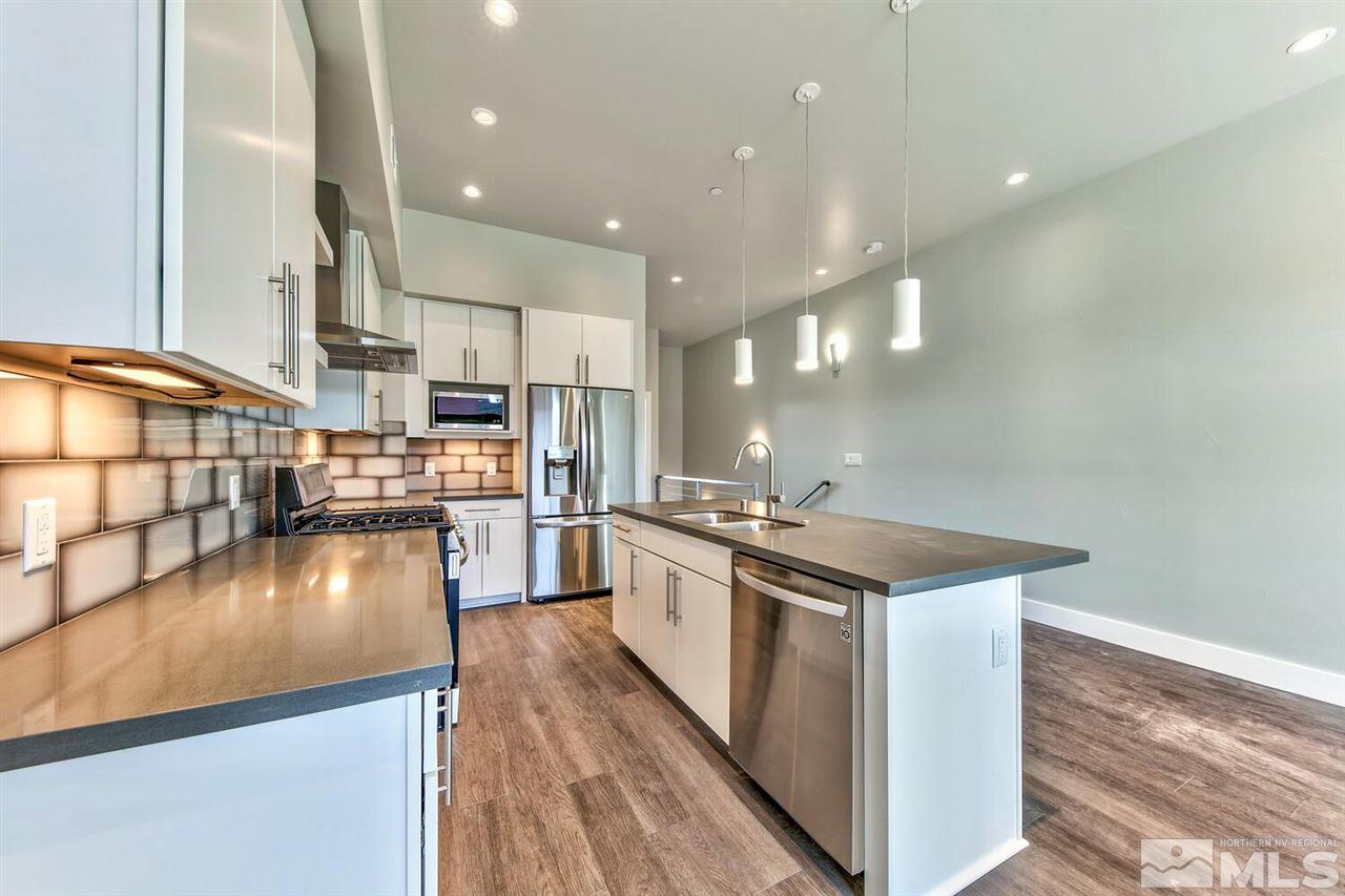 508 Mill Street Reno, NV 89502 - Photo 13 of 21 a kitchen with stainless steel appliances granite countertop a stove and a refrigerator