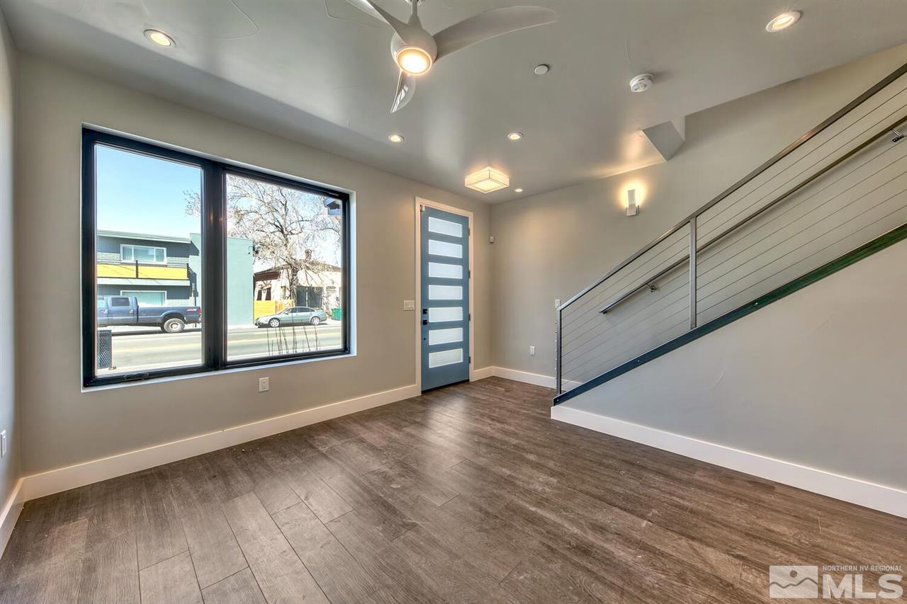 508 Mill Street Reno, NV 89502 - Photo 4 of 21 an empty room with wooden floor and windows