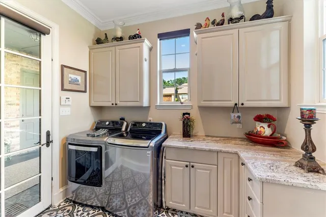 a kitchen with stainless steel appliances a stove a sink and cabinets