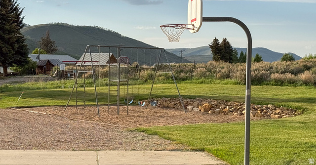 143 East Chestnut Street Helper, UT 84526 - Photo 20 of 35 View of sport court with a yard and a mountain view